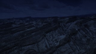 4K day for night color corrected aerial footage of the Waterpocket Fold rock formations, Capitol Reef National Park, Utah Aerial Stock Footage | AX130_303_DFN