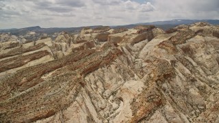 5.5K aerial stock footage pan across and flyby canyons in Waterpocket Fold rock formations, Capitol Reef National Park, Utah Aerial Stock Footage | AX130_304E