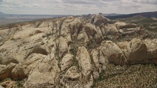 5.5K aerial stock footage of flying toward rock formations of Waterpocket Fold, Capitol Reef National Park, Utah Aerial Stock Footage | AX130_313