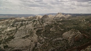 5.5K aerial stock footage approach and fly over Waterpocket Fold rock formations and canyons, Capitol Reef National Park, Utah Aerial Stock Footage | AX130_319E