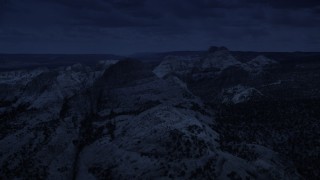 4K day for night color corrected aerial footage of approaching Waterpocket Fold rock formations, Capitol Reef National Park, Utah Aerial Stock Footage | AX130_320_DFN