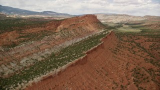 5.5K aerial stock footage of panning across the top of a mesa, Capitol Reef National Park, Utah Aerial Stock Footage | AX130_334