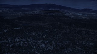 4K day for night color corrected aerial footage of approaching a desert peak, over desert vegetation, Capitol Reef National Park, Utah Aerial Stock Footage | AX130_338_DFN