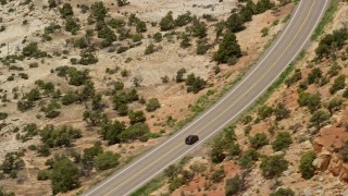 5.5K aerial stock footage of a black SUV on Route 12, Boulder, Utah Aerial Stock Footage | AX130_376E