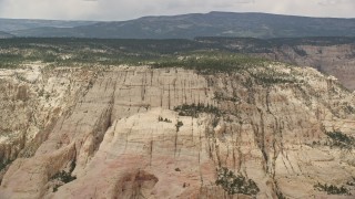 AX130_383 - 5.5K aerial stock footage of flying by a mountain peak, Grand Staircase-Escalante National Monument, Utah