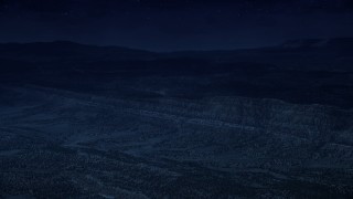 4K day for night color corrected aerial footage of approaching a mountain ridge from over a wide valley, Grand Staircase-Escalante National Monument, Utah Aerial Stock Footage | AX130_396_DFN