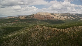 AX130_413E - 5.5K aerial stock footage wide view of a mesa and desert revealing Pine Lake, Barney Top Mesa, Utah