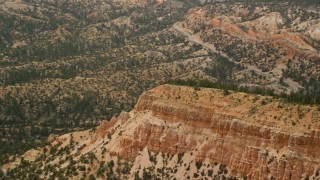 5.5K aerial stock footage of flying by end of thin mesa with steep slopes, Bryce Canyon National Park, Utah Aerial Stock Footage | AX130_427E