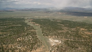 5.5K aerial stock footage of flying by forest and valleys outside the national park, Bryce Canyon National Park, Utah Aerial Stock Footage | AX130_491E