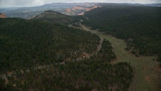 5.5K aerial stock footage of flying over Highway 63, forest, approach Bryce Canyon National Park, Utah Aerial Stock Footage | AX131_008E