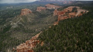 5.5K aerial stock footage of flying over cliffs near Mud Canyon Butte, Bryce Canyon National Park, Utah Aerial Stock Footage | AX131_013E