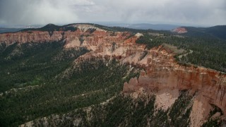 AX131_026 - 5.5K aerial stock footage approach and flyby rock formations, Pink Cliffs, Bryce Canyon National Park, Utah