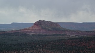 5.5K aerial stock footage of passing by Steamboat Rock butte, Glen Canyon National Recreation Area, Utah, Arizona Aerial Stock Footage | AX131_076