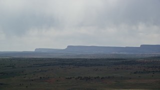 5.5K aerial stock footage of flying by tall mesa cliffs, Glen Canyon National Recreation Area, Utah, Arizona Aerial Stock Footage | AX131_077