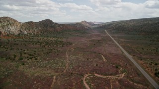 5.5K aerial stock footage of flying by light traffic on Highway 89, Glen Canyon National Recreation Area, Utah, Arizona Aerial Stock Footage | AX131_084E