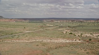 5.5K aerial stock footage follow Highway 89, focus on butte, Glen Canyon National Recreation Area, Utah, Arizona Aerial Stock Footage | AX131_095E