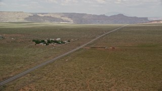 5.5K aerial stock footage of Highway 89 by buildings, Glen Canyon National Recreation Area, Utah, Arizona Aerial Stock Footage | AX131_106