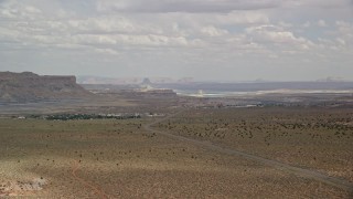 5.5K aerial stock footage of approaching a small rural town near Highway 89, Big Water, Utah Aerial Stock Footage | AX131_111