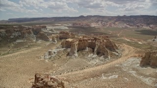 5.5K aerial stock footage of flying by rocky buttes at Glen Canyon National Recreation Area, Utah, Arizona Aerial Stock Footage | AX131_123