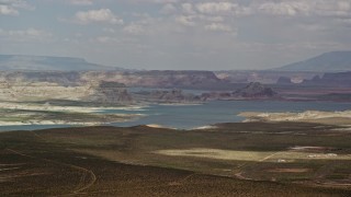 5.5K aerial stock footage of flying by Lake Powell, Glen Canyon National Recreation Area, Utah, Arizona Aerial Stock Footage | AX131_125