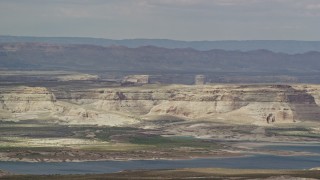 5.5K aerial stock footage of flying by mesa and Lake Powell, Glen Canyon National Recreation Area, Utah, Arizona Aerial Stock Footage | AX131_128