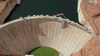 AX131_148 - 5.5K aerial stock footage tilt to bird's eye view of Glen Canyon Dam and Bridge, Arizona