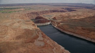 5.5K aerial stock footage approach and tilt to Glen Canyon Dam, Glen Canyon Dam Bridge, Arizona Aerial Stock Footage | AX131_150E