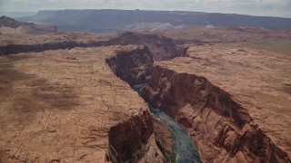 5.5K aerial stock footage of flying by Colorado River flowing through Glen Canyon, Arizona Aerial Stock Footage | AX131_168