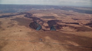 5.5K aerial stock footage of flying to the edge of Horseshoe Bend, tilt to Colorado River, Glen Canyon, Arizona Aerial Stock Footage | AX131_174E