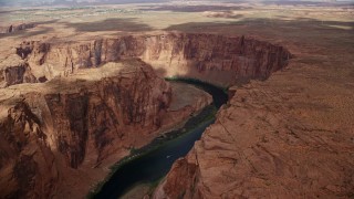 5.5K aerial stock footage of flying by Horseshoe Bend, tilt to Colorado River, Glen Canyon, Arizona Aerial Stock Footage | AX131_211E