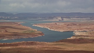 5.5K aerial stock footage of passing Lake Powell, mesas in the background, Utah, Arizona Aerial Stock Footage | AX131_227