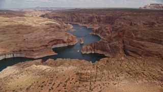 5.5K aerial stock footage of approaching and flying over Lake Powell, cliffs, rock formations, Navajo Canyon, Arizona Aerial Stock Footage | AX131_228E