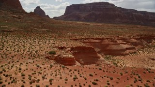 5.5K aerial stock footage of mesa cliffs and desert vegetation, Navajo Nation Reservation, Arizona Aerial Stock Footage | AX131_248