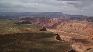 5.5K aerial stock footage of a wide canyon between mesas, Navajo Nation Reservation, Utah Aerial Stock Footage | AX132_017E