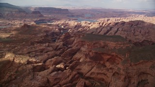 5.5K aerial stock footage wide view of rock formations in canyon near Lake Powell, Navajo Nation Reservation, Utah Aerial Stock Footage | AX132_028E