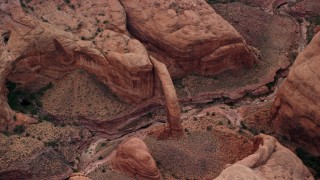 AX132_032E - 5.5K aerial stock footage of a bird's eye view of Rainbow Bridge National Monument, Utah