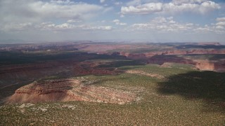 5.5K aerial stock footage of flying by desert canyons and mesas at Navajo Nation Reservation, Arizona, Utah Aerial Stock Footage | AX132_078E