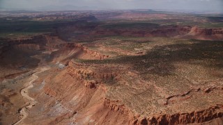 5.5K aerial stock footage of passing by dry riverbed in desert canyon, Navajo Nation Reservation, Arizona, Utah Aerial Stock Footage | AX132_083E