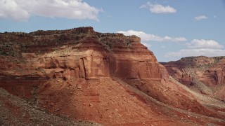 5.5K aerial stock footage of flying by steep mesa cliffs, Navajo Nation Reservation, Arizona, Utah Aerial Stock Footage | AX132_099