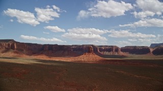 5.5K aerial stock footage of flying toward a tall butte, mesas in distance, Navajo Nation Reservation, Arizona, Utah Aerial Stock Footage | AX132_101