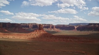 5.5K aerial stock footage of orbiting tall butte, surrounded by mesas, Navajo Nation Reservation, Arizona, Utah Aerial Stock Footage | AX132_102E