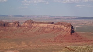 5.5K aerial stock footage of passing by Train Rock, desert valley, Navajo Nation Reservation, Arizona, Utah Aerial Stock Footage | AX132_124E