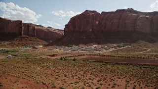 AX132_137 - 5.5K aerial stock footage of flying by Goulding's Lodge, Goulding, Utah