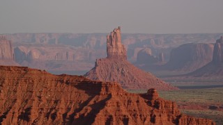 5.5K aerial stock footage of Big Indian Butte in Monument Valley, Utah, Arizona, sunset Aerial Stock Footage | AX133_009E