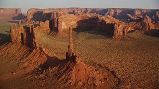 AX133_041E - 5.5K aerial stock footage orbit buttes in the desert, Monument Valley, Utah, Arizona, twilight