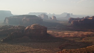 5.5K aerial stock footage of flying by and approaching mesas, buttes in Monument Valley, Utah, Arizona, twilight Aerial Stock Footage | AX133_046E