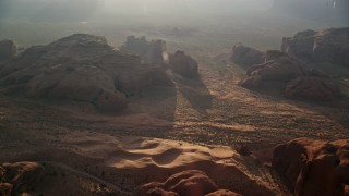 5.5K aerial stock footage of approaching rock formations, Monument Valley, Utah, Arizona, sunset Aerial Stock Footage | AX133_060