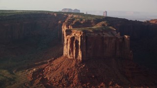 5.5K aerial stock footage of flying by Mitchell Mesa in Monument Valley, Utah, Arizona, twilight Aerial Stock Footage | AX133_071E