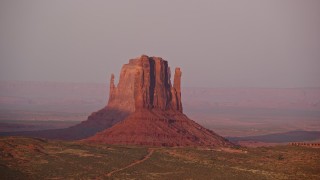 5.5K aerial stock footage flyby West Mitten Butte and East Mitten Butte, Monument Valley, Utah, Arizona, sunset Aerial Stock Footage | AX133_167E