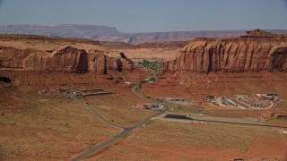 AX135_003 - 5.5K aerial stock footage flyby Goulding's Lodge, Oljeto Mesa by Monument Valley Airport, Utah